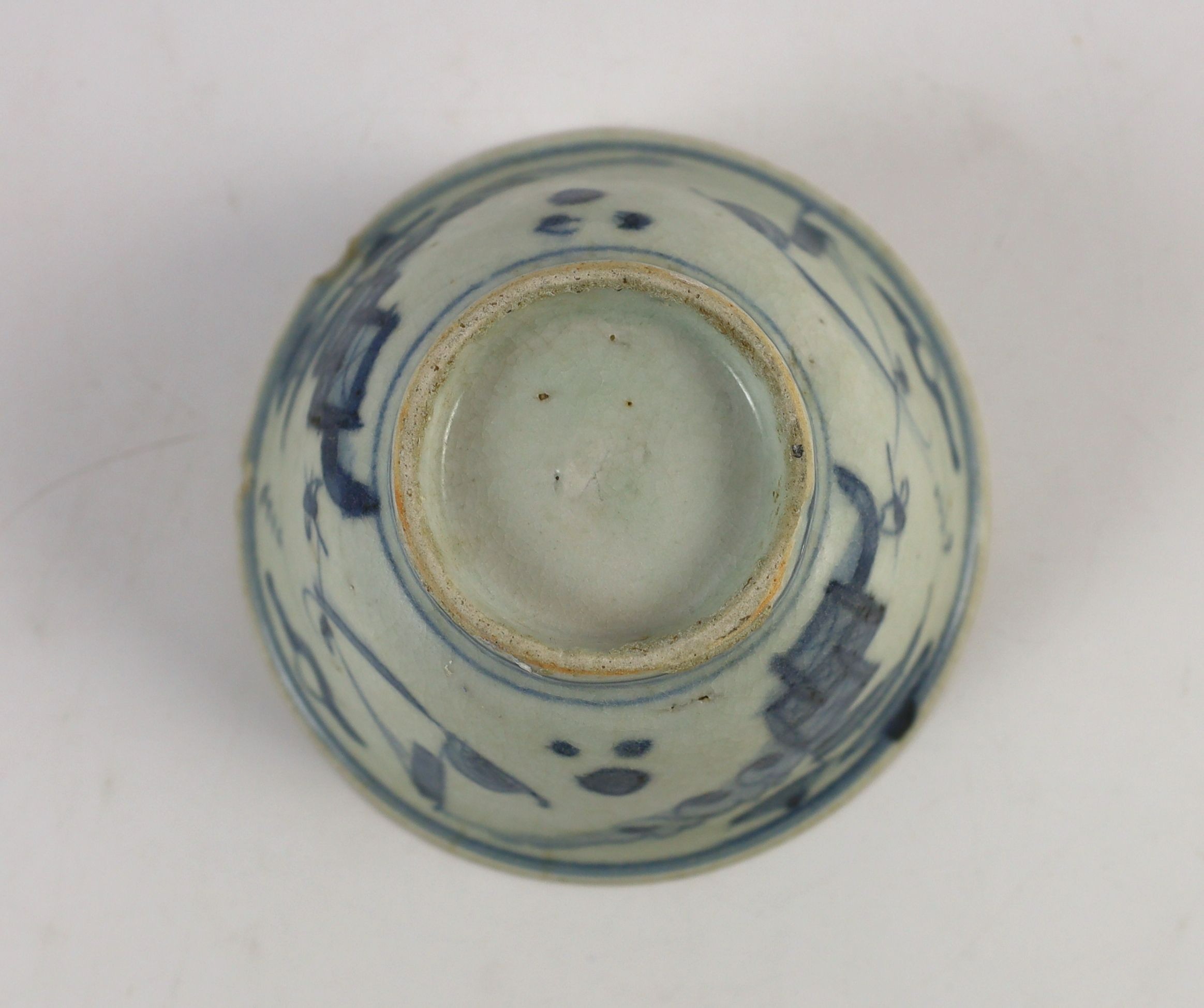 A Chinese Transitional inscribed blue and white bowl, mid 17th century, 12cm diameter, cracked